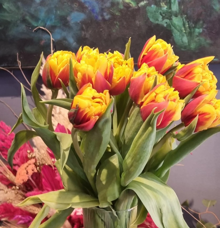 Yellow and orange double tulips arranged in a glass vase in our Casablanca shop